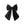 Load image into Gallery viewer, Black bow clip with white polka dots on a white background