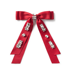 Rhinestone-embellished bow clip with double-layered design and satin fabric.