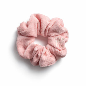 A pink Halo Luxe Terry cloth scrunchie on a white background.
