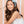 Load image into Gallery viewer, teenage girl wearing eyelet side bow headband in powder blue