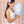 Load image into Gallery viewer, A teenage girl wearing eyelet side bow headband in cream by Halo Luxe