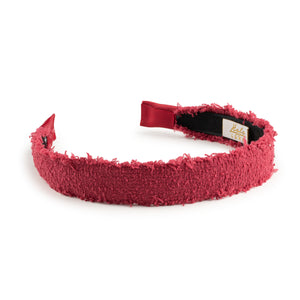 Red textured headband on a white background