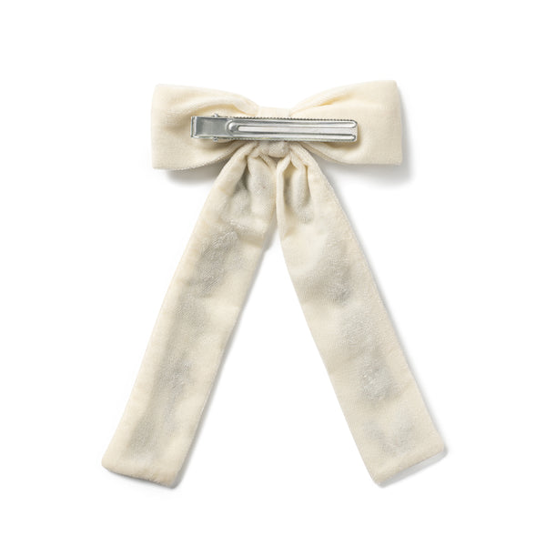 back side of a Cream colored bow hair clip with aligator clip