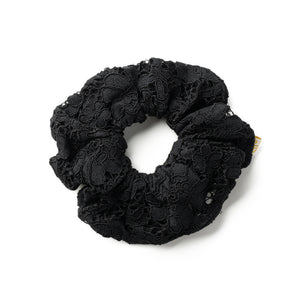 Black lace scrunchie on a white background