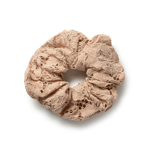 Beige lace scrunchie on a white background