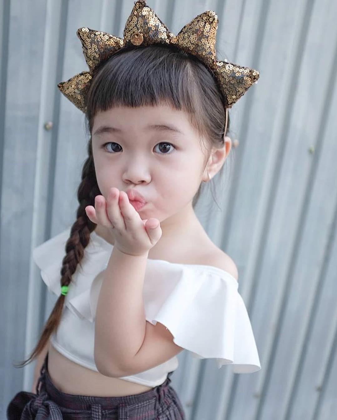 a little girl wearing halloween crown