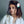 Load image into Gallery viewer, Young girl with a unicorn hair clip on a plain background
