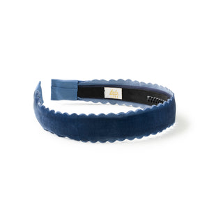 Navy blue velvet headband with scalloped edge on a white background