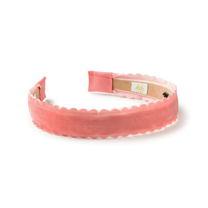 Pink velvet headband with Haloluxe branding on white background