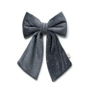 Gray bow with white polka dots on a white background