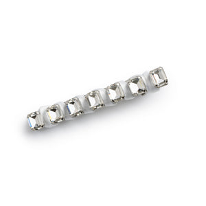 A white satin hair clip with embellished crystals, secured with an alligator clip at the base.