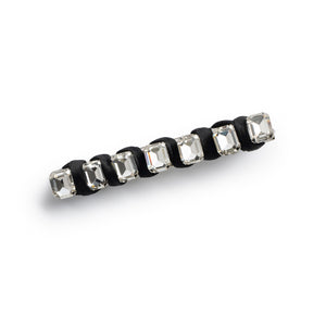 A black satin hair barrette with all-over embellished crystals.
