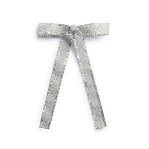 A silver deconstructed grosgrain ribbon clip  with a long tail clip, hand-crafted with raw edges and an alligator clip at the base.