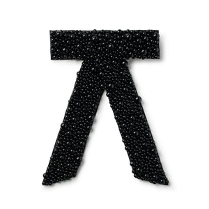 pearl hair clip in a bow shape in black color