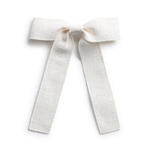 A white linen hair clip with a bow knot tail 