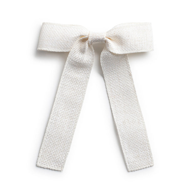 A white linen hair clip with a bow knot tail 