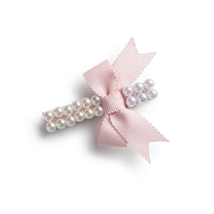 an alligator hair clip with a double strand pearl design and a grosgrain bow, in a pink color