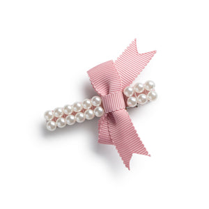 A Bow hair clip with pearl design and a grosgrain bow in a mauve color.