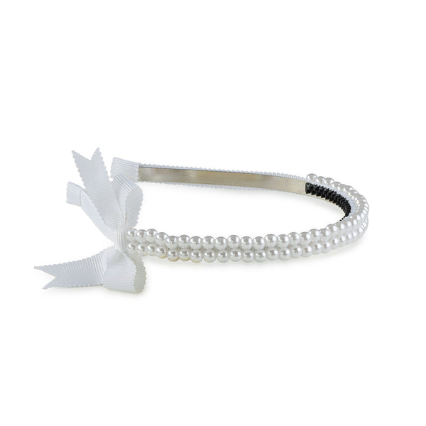 A white headband featuring a double-strand pearl design with a grosgrain bow on the side.