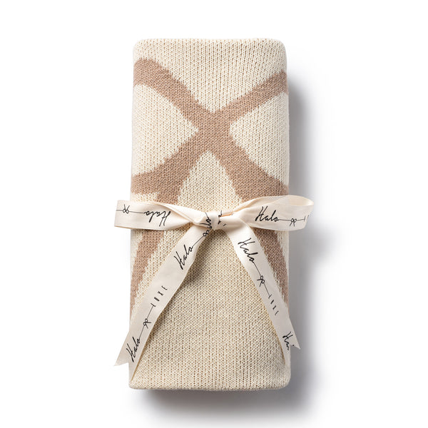 Taupe colour hand knitted baby blanket with soft double face knit and  is 100% cotton with signature logo bow in the center - Halo Luxe
